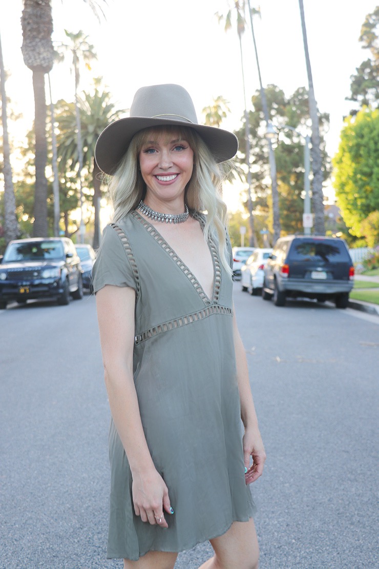 olive dress with tan hat